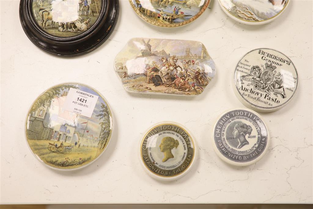 A collection of eleven Pratt pot lids, two Continental porcelain figures and a coronation mug